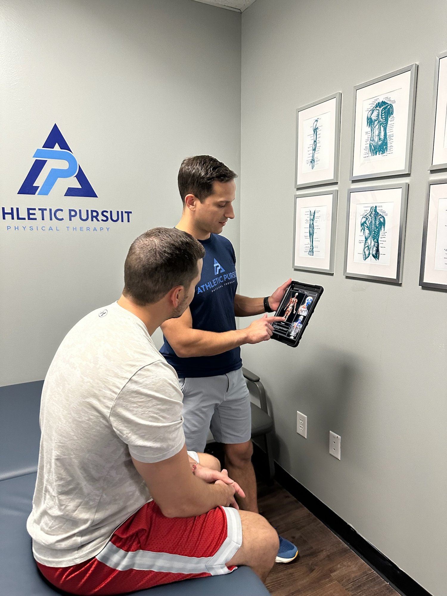 Physical therapist planning care with patient